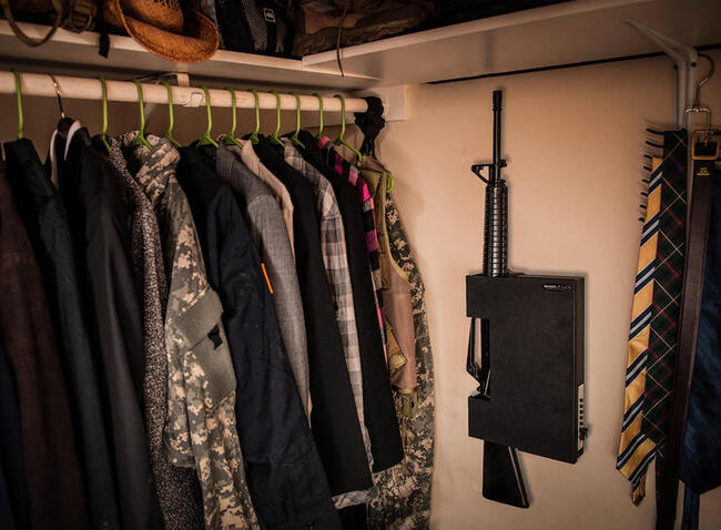 A ShotLock with an AR secured in the closet of a home.