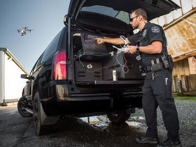Police deploys drone from Drone Responder TruckVault in back of Chevrolet Suburban