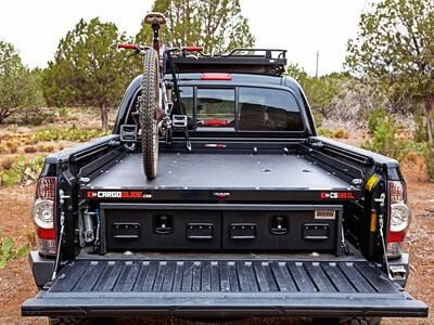 A Toyota Tacoma with a TruckVault, Cargo Glide, and mountain bike.