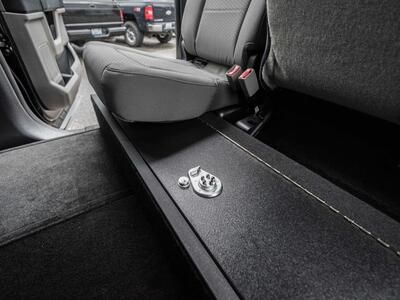 A SeatVault in the back of a Ford F150 with one seat folded down.