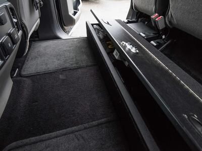 A picture of a SeatVault and the backseat carpet space in a Ford F150.