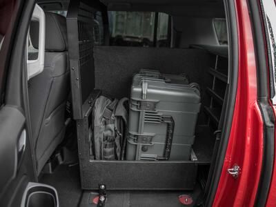 The Inside of a fire department Chevy Suburban with a custom TruckVault and Pelican case.