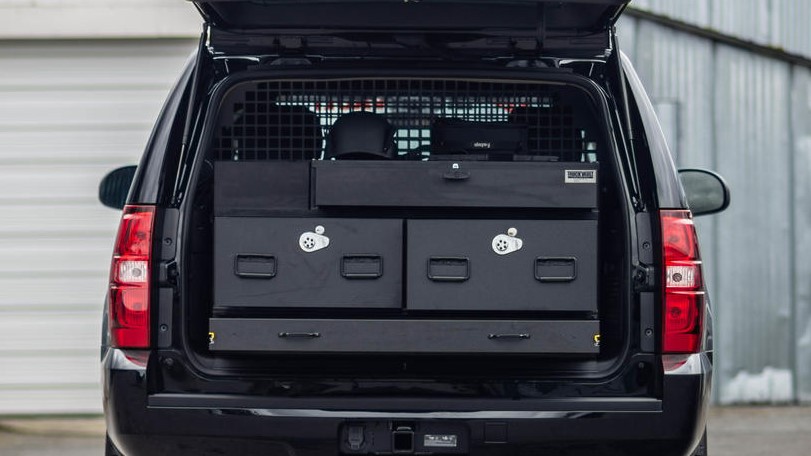 A Commander Line TruckVault in the back of a Chevy Tahoe.