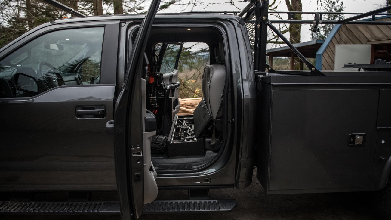 A Ford F250 with a SeatVault installed in the cab of the truck.