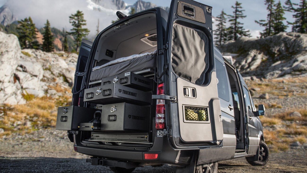 A Mercedes Sprinter van with a stacked TruckVault storage system.