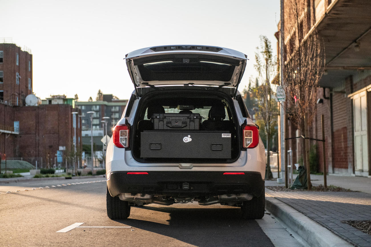 A 2020 Ford Explorer with a Base Model TruckVault installed in the cargo area.