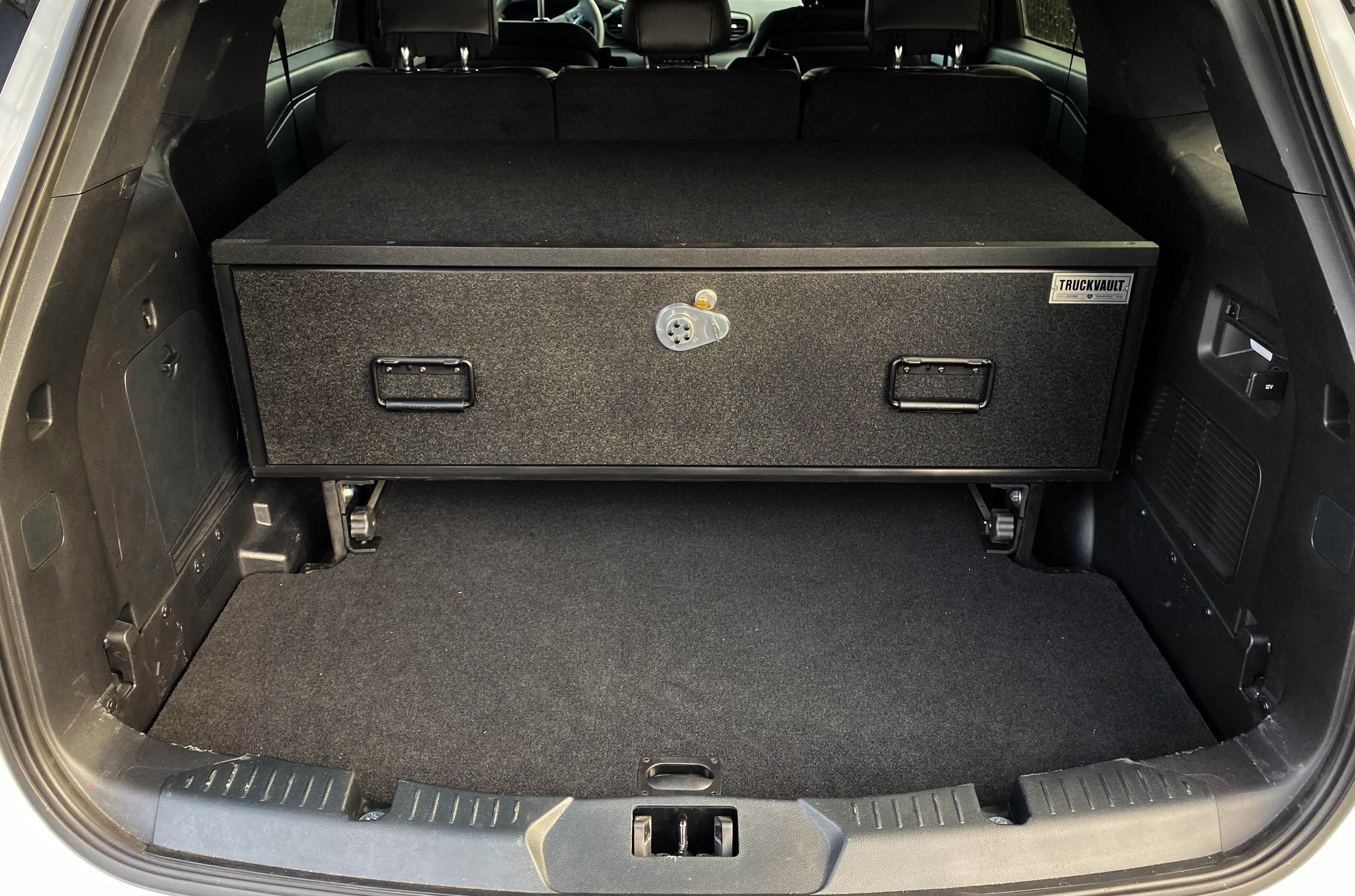 A Spare Access TruckVault in the back of a 2020 Ford Explorer.
