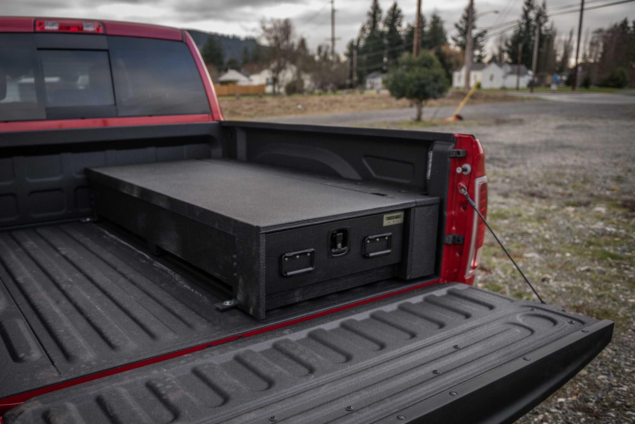 A Ram 2500 with a half-width TruckVault in the bed.
