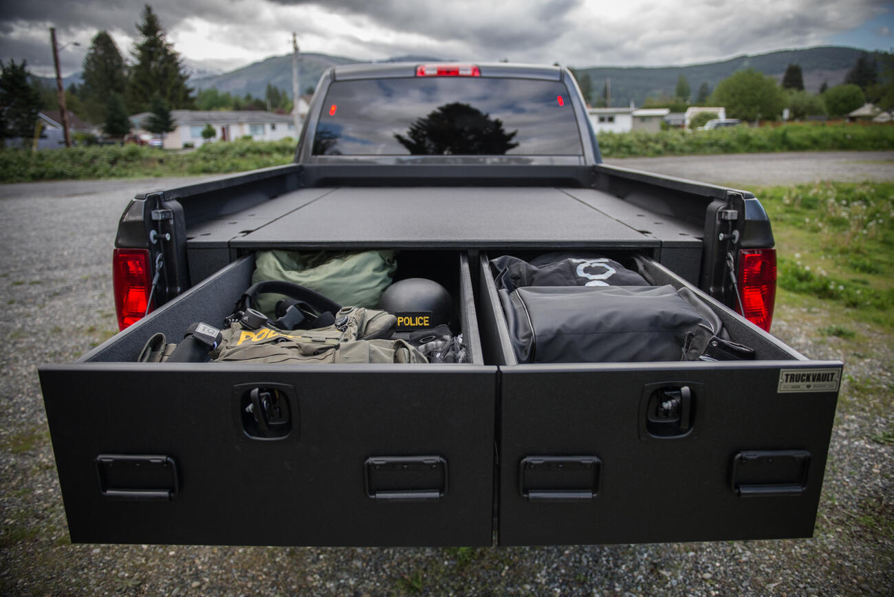 offset drawers extended in TruckVault secure truck bed storage on Dodge Ram pickup truck