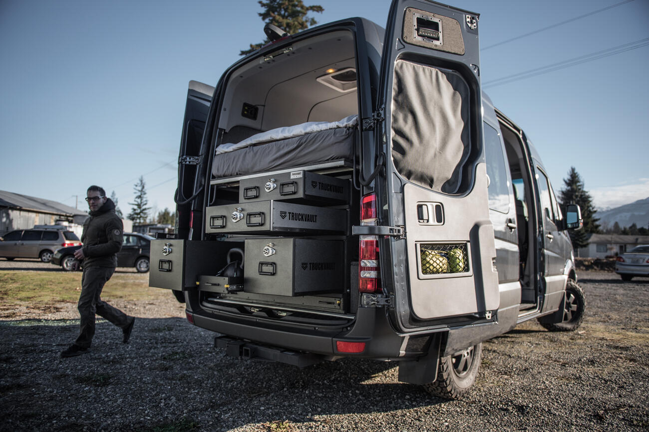Overlanding camping vehicle organization using TruckVault secure storage system in Mercedes Sprinter van