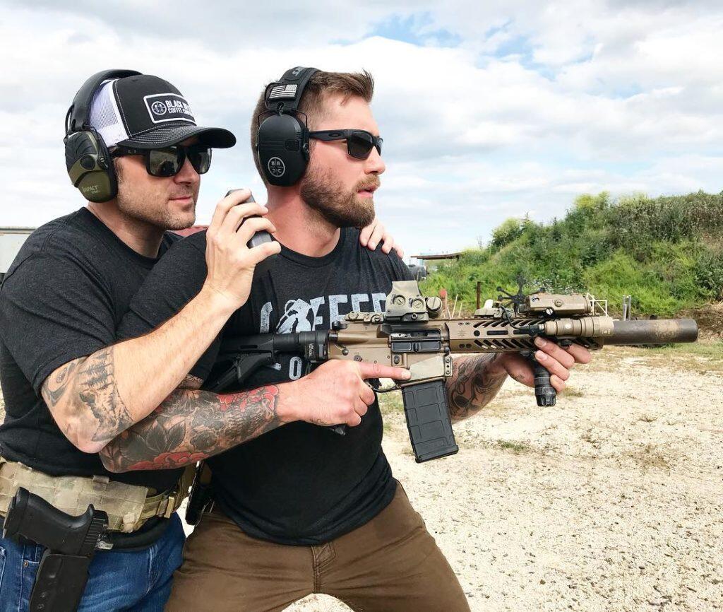 Firearm instructor and student with rifle