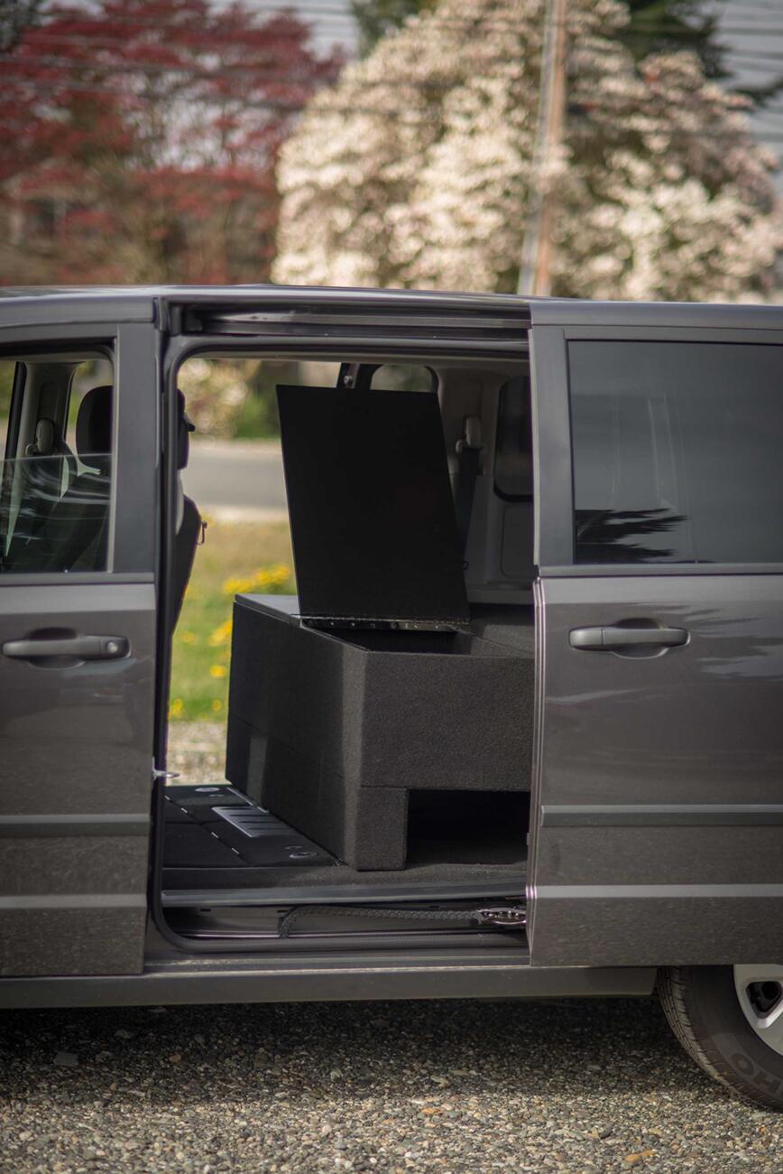 Dodge-Caravan-4_Lowres.jpg The side of a black Dodge Grand Caravan with a TruckVault inside.