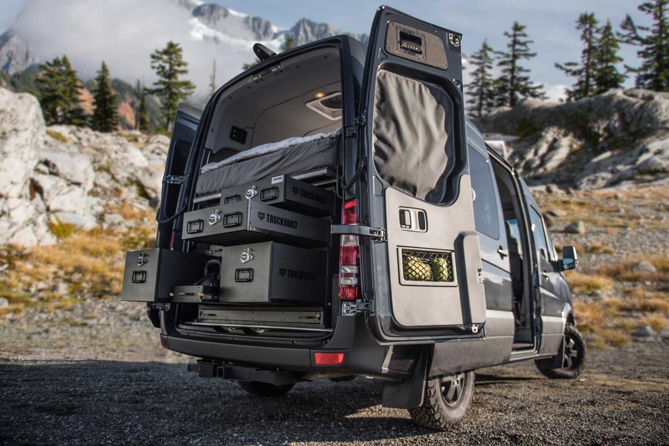 A TruckVault secure storage system in the back of a Mercedes Sprinter van.