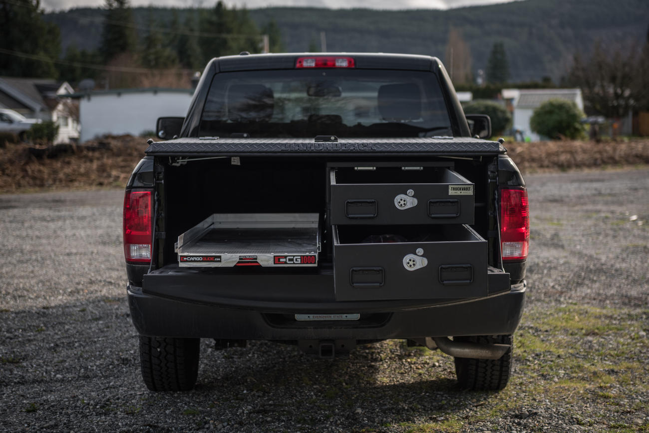 pickup truck with half width drawers stacked on passenger side and cargo glide on driver side