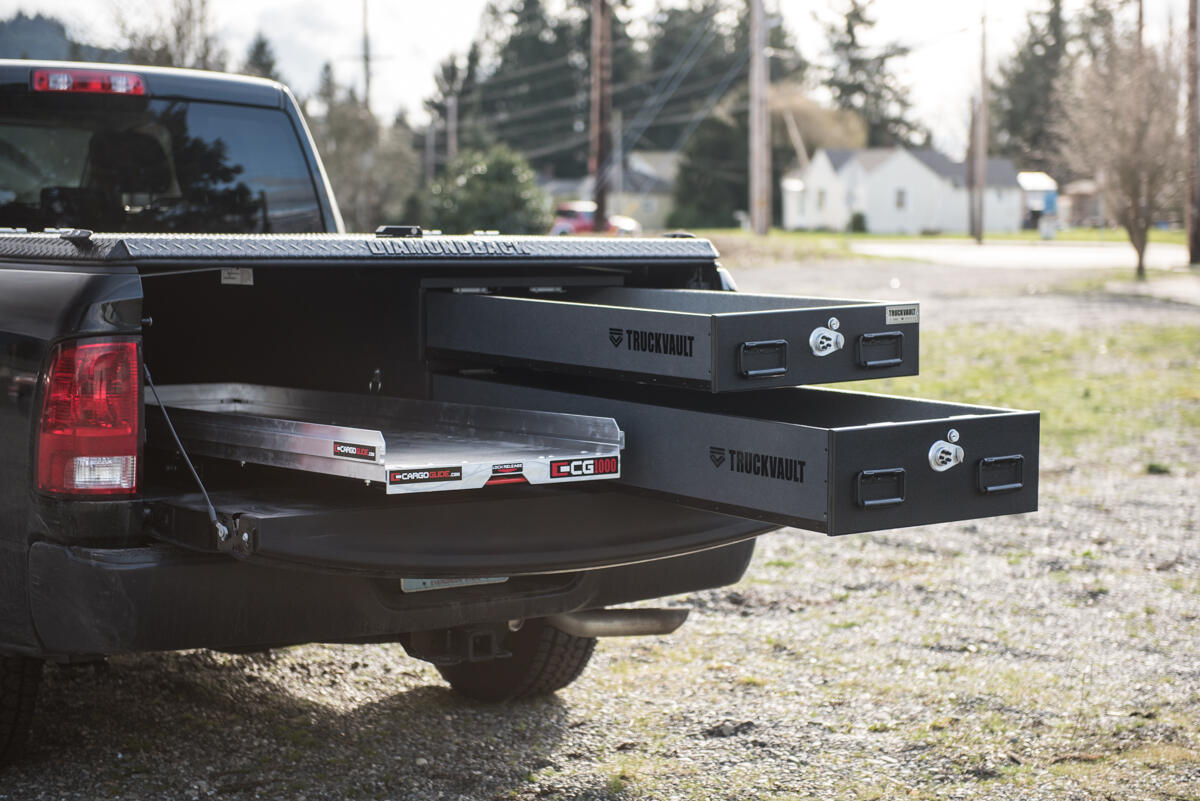 pickup truck with half width drawers stacked on passenger side and cargo glide on driver side drawers and glide extended