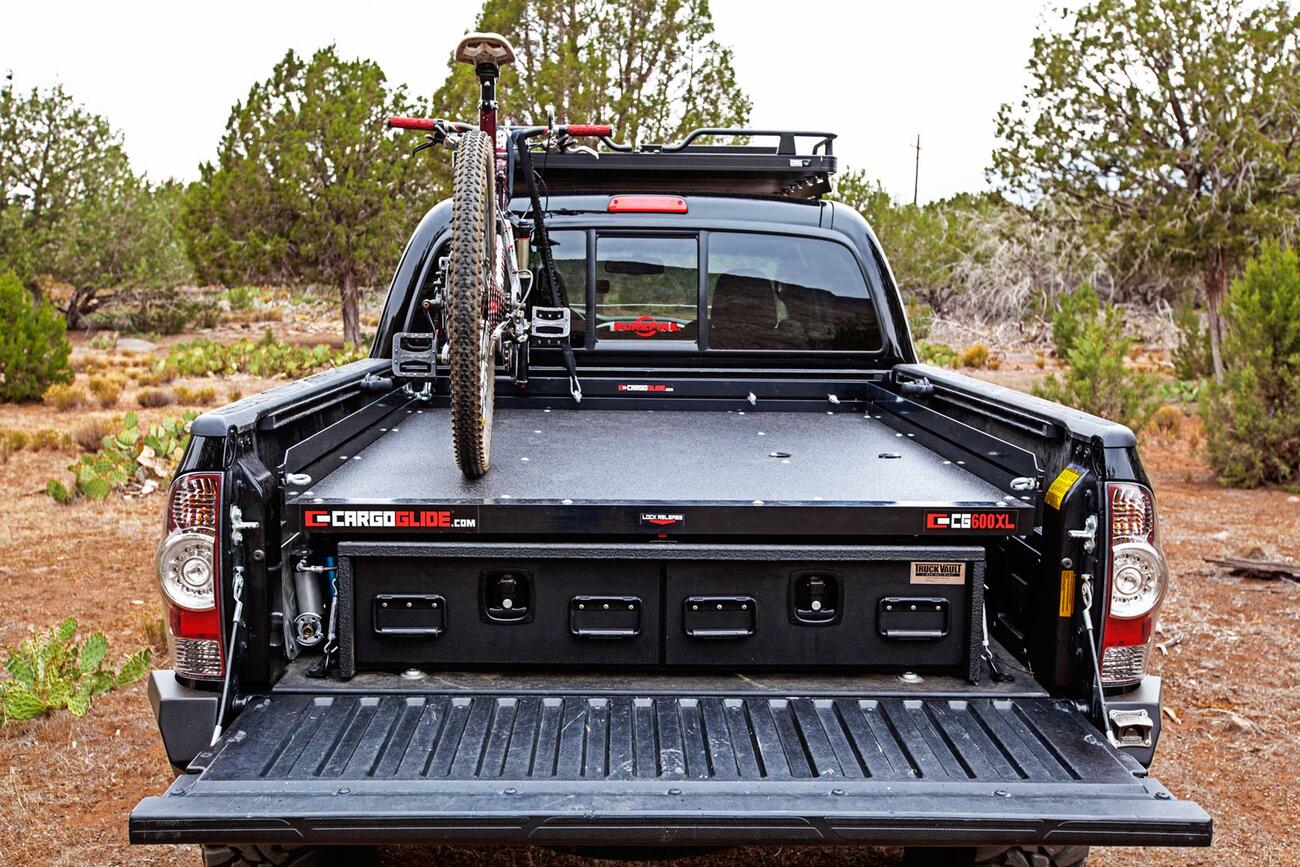 A Toyota Tacoma with a TruckVault, Cargo Glide, and mountain bike.