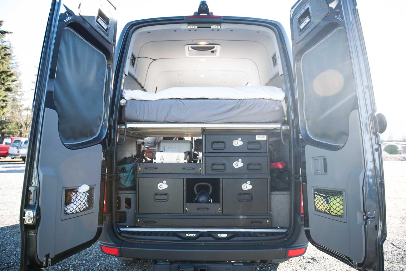 A TruckVault secure storage system in the back of a Mercedes Sprinter.