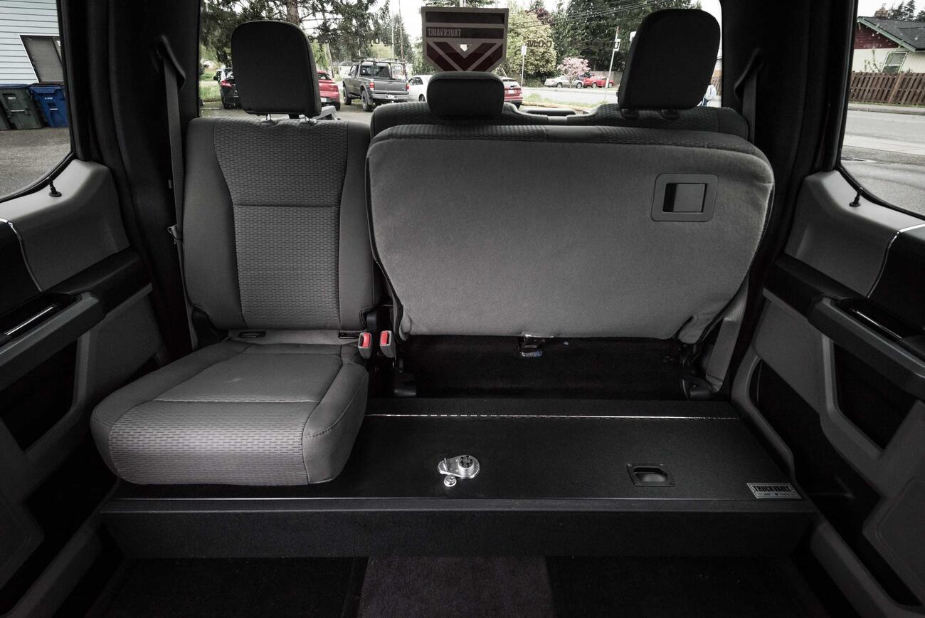 A Ford F-150 SeatVault with half the back row seat folded up.