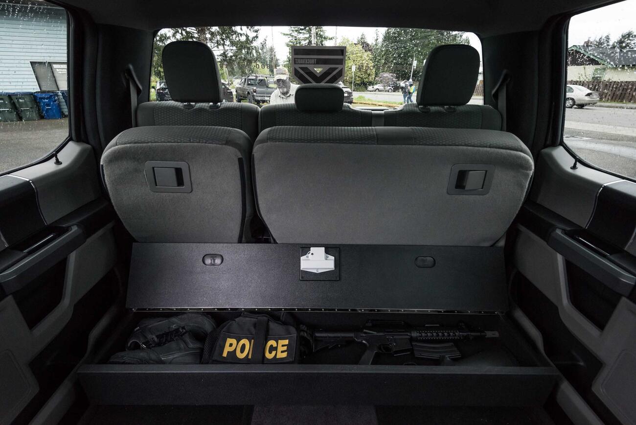 A SeatVault under the back seat of a Ford F150 used to store police gear.