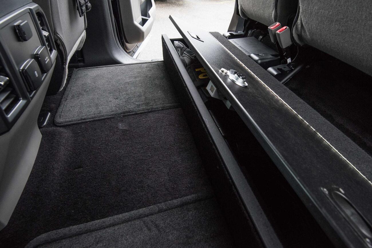 A picture of a SeatVault and the backseat carpet space in a Ford F150.