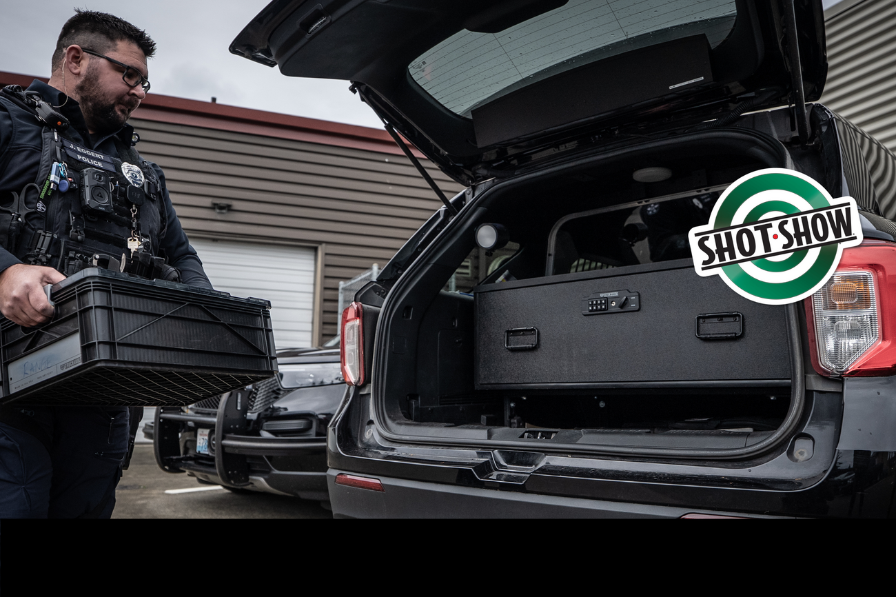 Officer placing SIDIO Crate into SUV with a Magnum Base Line drawer featuring TacLock. SHOT Show logo appears on the right side