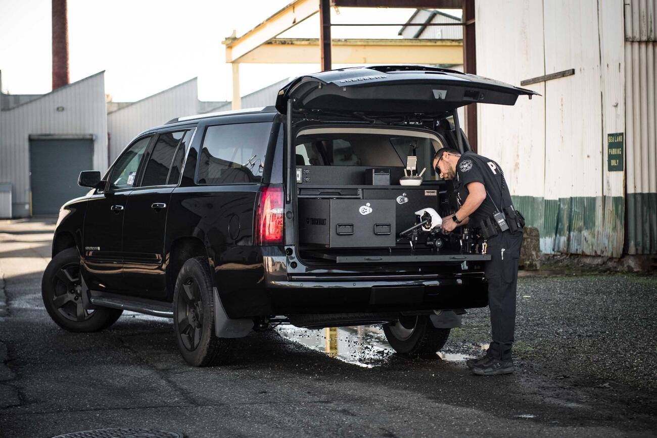 TruckVault SUV Storage Chevy Tahoe with Drone Responder Line installed in rear of the SUV