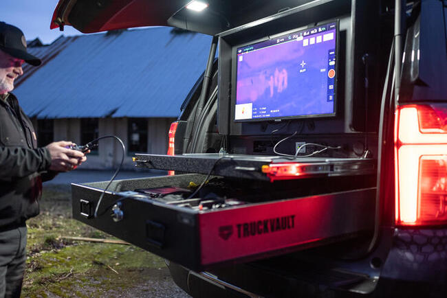 UAV pilot operates out of a TruckVault Drone Responder 9 with a thermal imaging drone