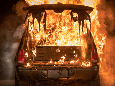 Durango burning with TruckVault installed back hatch melting in flames