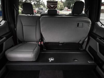 A Ford F-150 SeatVault with half the back row seat folded up.