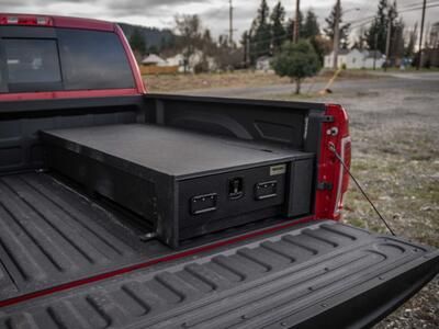 A Ram 2500 with a half-width TruckVault in the bed.